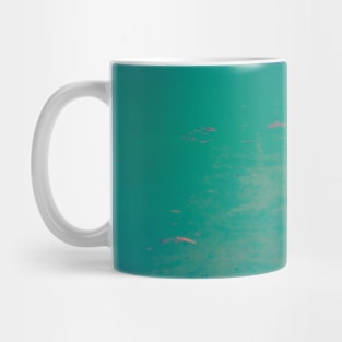 Water in different colors of blue, pink and orange Mug